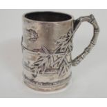 A CHINESE SILVER FAUX BAMBOO MUG decorated with insects amongst bamboo,divided by a monogram,