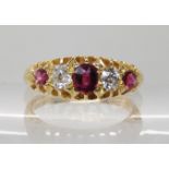 AN 18CT GOLD SYNTHETIC RUBY AND DIAMOND RING in scalloped mount, combined diamond weight estimated