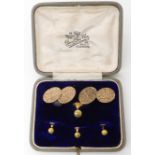 A BOXED SET OF CUFFLINKS AND SHIRT STUDS WITH FLORAL ENGRAVING combined weight 11.5gms Condition