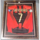 A RED AND BLACK AC MILAN SHIRT No.7, the reverse lettered Shevchenko also autographed by Shevchenko,