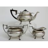 A THREE PIECE SILVER TEA SERVICE by James Deakin & Son, Sheffield 1919, of rounded rectangular
