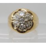 A 10K GOLD GENTS DIAMOND FLOWER CLUSTER RING set with estimated approx 0.70cts of brilliant cut