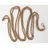 A FANCY LINK YELLOW METAL GUARD CHAIN stamped 9ct to the clasp, length approx 151cm, weight 25gms