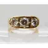 AN 18CT GOLD GENTS THREE STONE DIAMOND RING set with estimated approx 1.50cts of brilliant cut