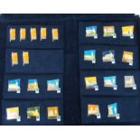 A LARGE COLLECTION OF 2004 OLYMPIC TORCH RELAY ENAMEL LAPEL BADGES in blue plush folder and framed