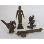 AN INDIAN BRASS TEMPLE TOY with a noble figure riding his horse, 14cm high, brass bird finial,