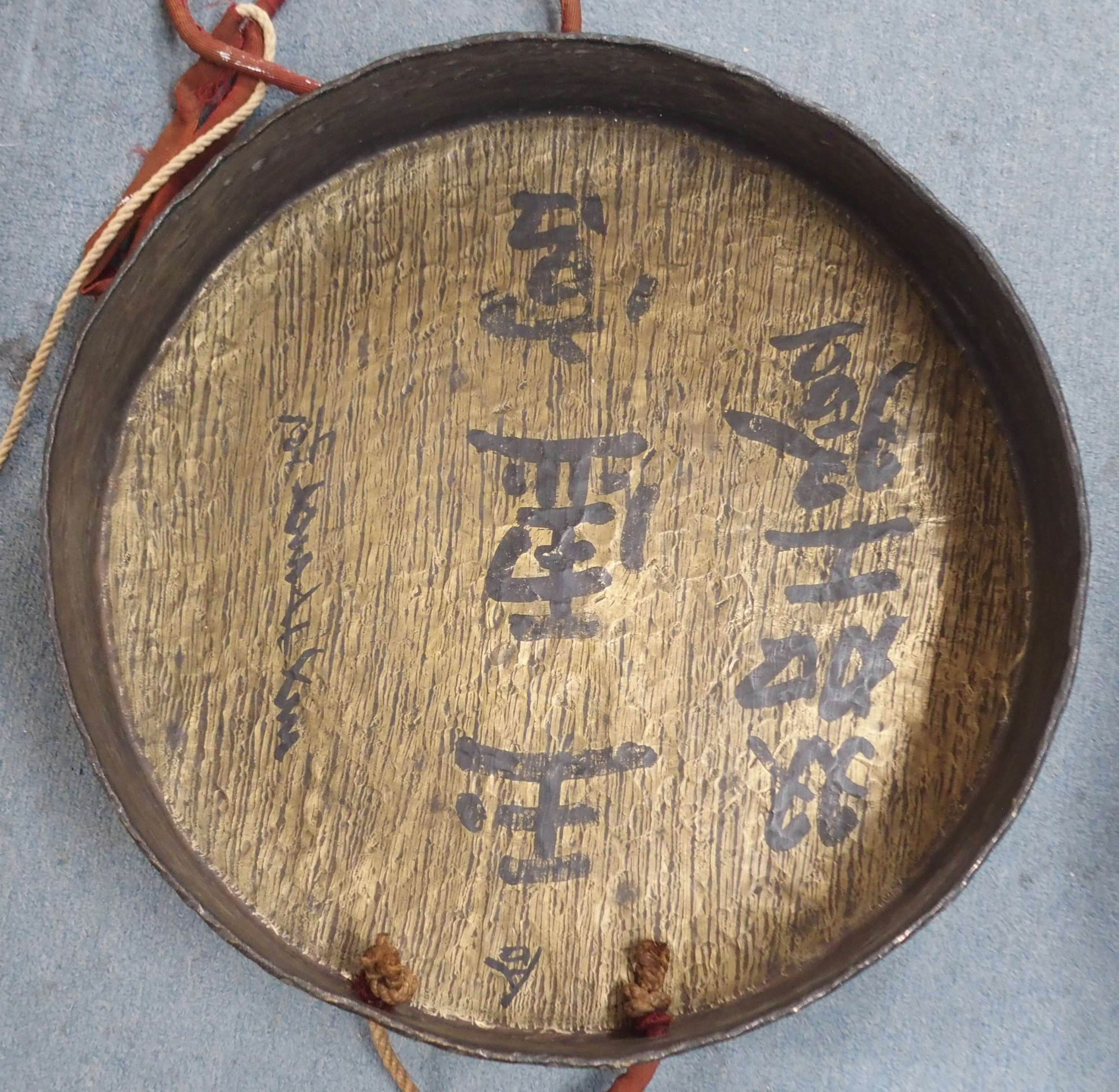 AN ASIAN BRASS GONG the hammered surface with deep rim, signed to the interior, with cord and - Image 2 of 5