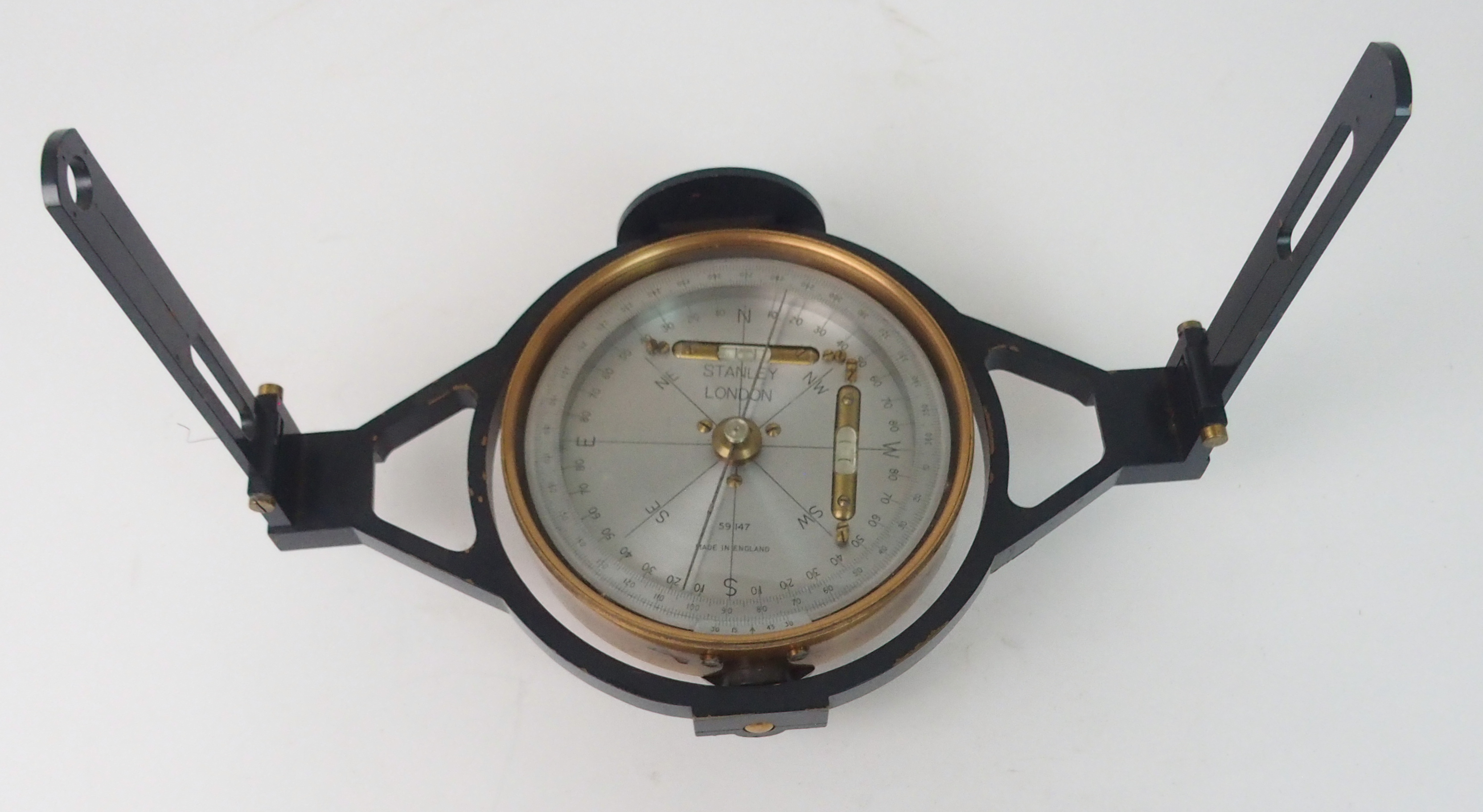 A STANLEY, LONDON SURVEYING COMPASS with silvered dial, stamped Stanley London, 59147 brass circular