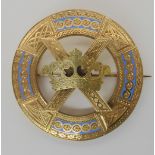 A YELLOW METAL SCOTTISH THEMED BROOCH engraved with Celtic knot work, St. Andrew's crowned cross,