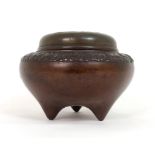 A CHINESE BRONZE INCENSE BURNER the pierced cover decorated with a pictogram Sho character, the