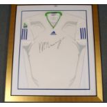 A WHITE SHORT-SLEEVED TENNIS SHIRT circa 2011, autographed by Andy Murray, framed and glazed, 93