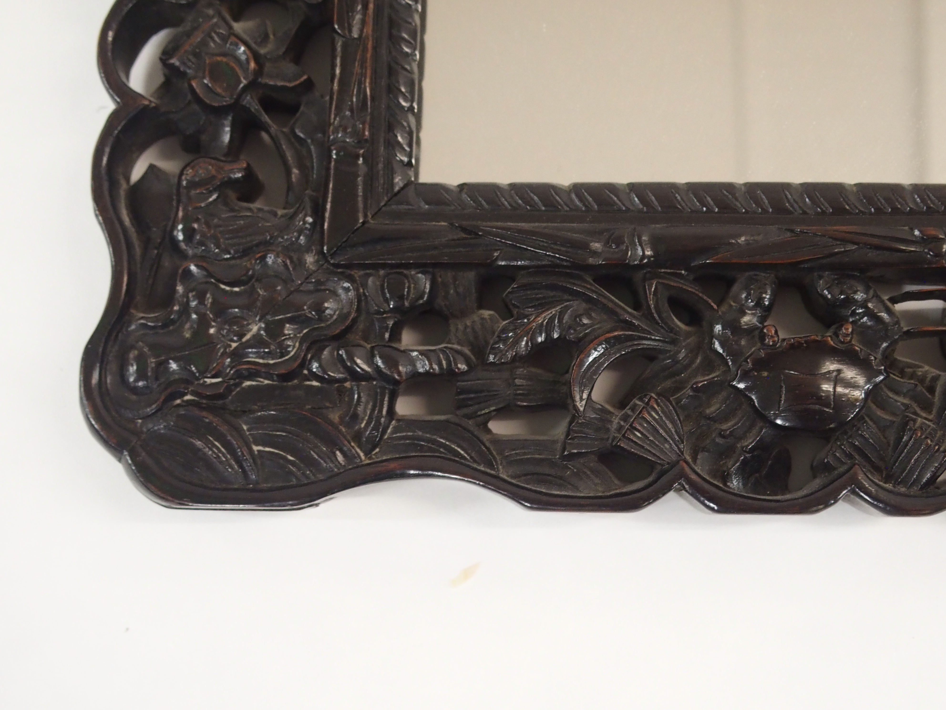 A CHINESE HARDWOOD WALL MIRROR the pierced frame carved with dragons chasing the flaming pearl of - Image 5 of 7