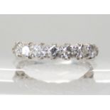 AN 18CT WHITE GOLD SEVEN STONE DIAMOND RING set with estimated approx 0.70cts of brilliant cut