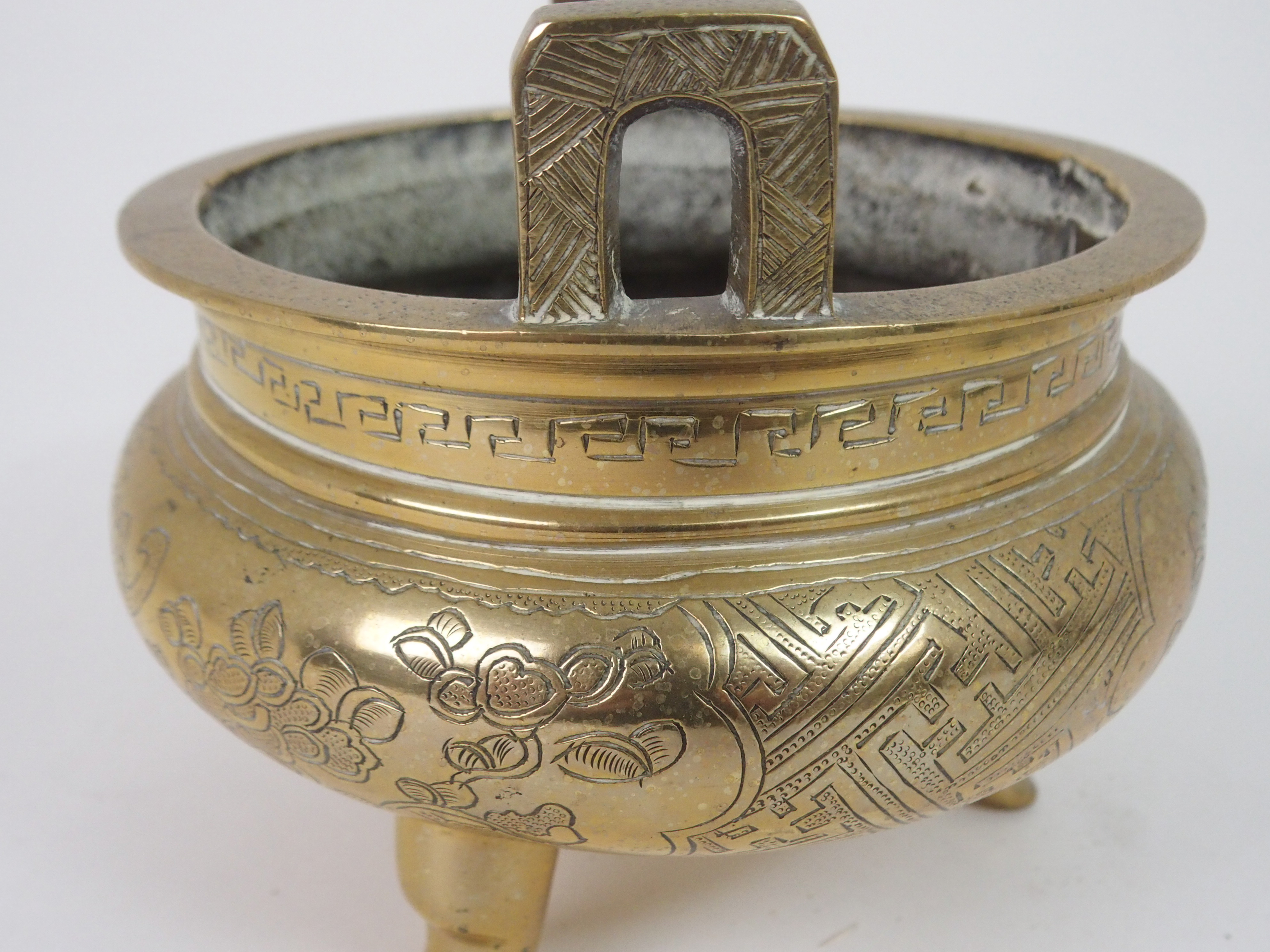 A CHINESE BRASS INCENSE BURNER with lug handles above a key pattern band and decorated with precious - Image 6 of 6