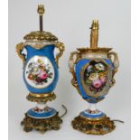 A SEVRES STYLE TABLE LAMP of two handled urn form, painted with flowers within gilt cartouches, with