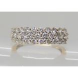 A 9CT GOLD THREE ROW DIAMOND CLUSTER RING