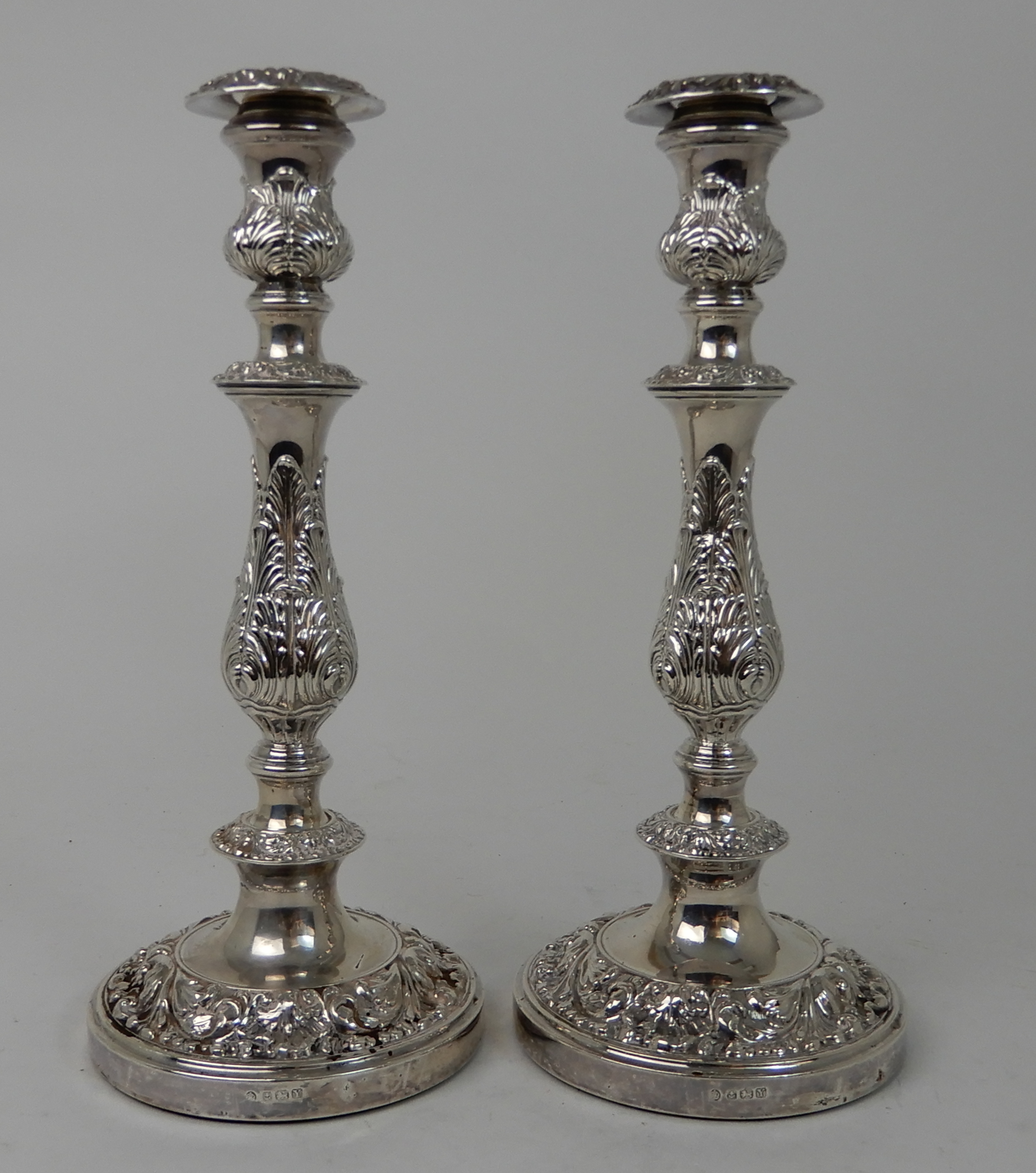 A PAIR OF SILVER CANDLESTICKS maker's mark BLD Birmingham 1948, the removable drip pans on