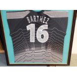 A BLACK AND GREY FRANCE GOALKEEPER'S SHIRT No.16, the reverse lettered Barthez, also autographed