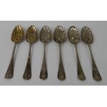 A SET OF SIX ANTIQUE SILVER BERRY SPOONS unclear London hallmark, the terminals bearing a crest,
