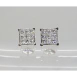 A PAIR OF PLATINUM PRINCESS CUT DIAMOND EARRINGS