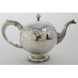 A GEORGE II SILVER TEAPOT by Hugh Gordon, Edinburgh 1746 of bullet shape with engraved foliate