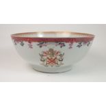 A CHINESE ARMORIAL PUNCH BOWL painted with two coats of arms for Lennox, beneath diaper,flowers
