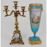 A SEVRES PATTERN VASE painted with a maiden and cherubs upon mythical beasts, the opposite side