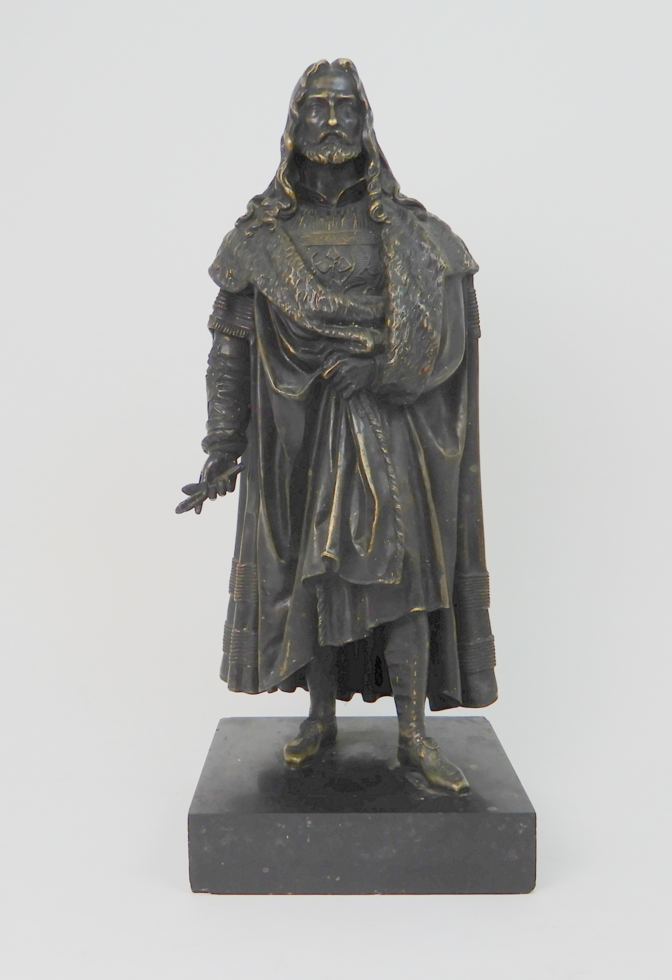 A BRONZED MODEL OF A MAN wearing fur trimmed robes, upon slate base, 46cm high Condition Report: - Image 2 of 7
