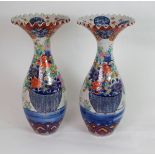 A PAIR OF ARITA BALUSTER VASES each printed and painted with baskets of flowers, beneath frilled