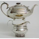 A GEORGE IV SILVER TEAPOT by Richard Pearce, London 1825, of rounded rectangular form, the curving