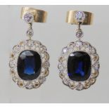 A PAIR OF SAPPHIRE AND DIAMOND DROP EARRINGS the cushion cut sapphires measure