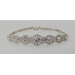 AN ART DECO DIAMOND BRACELET set throughout in white metal with sprung strap with box clasp