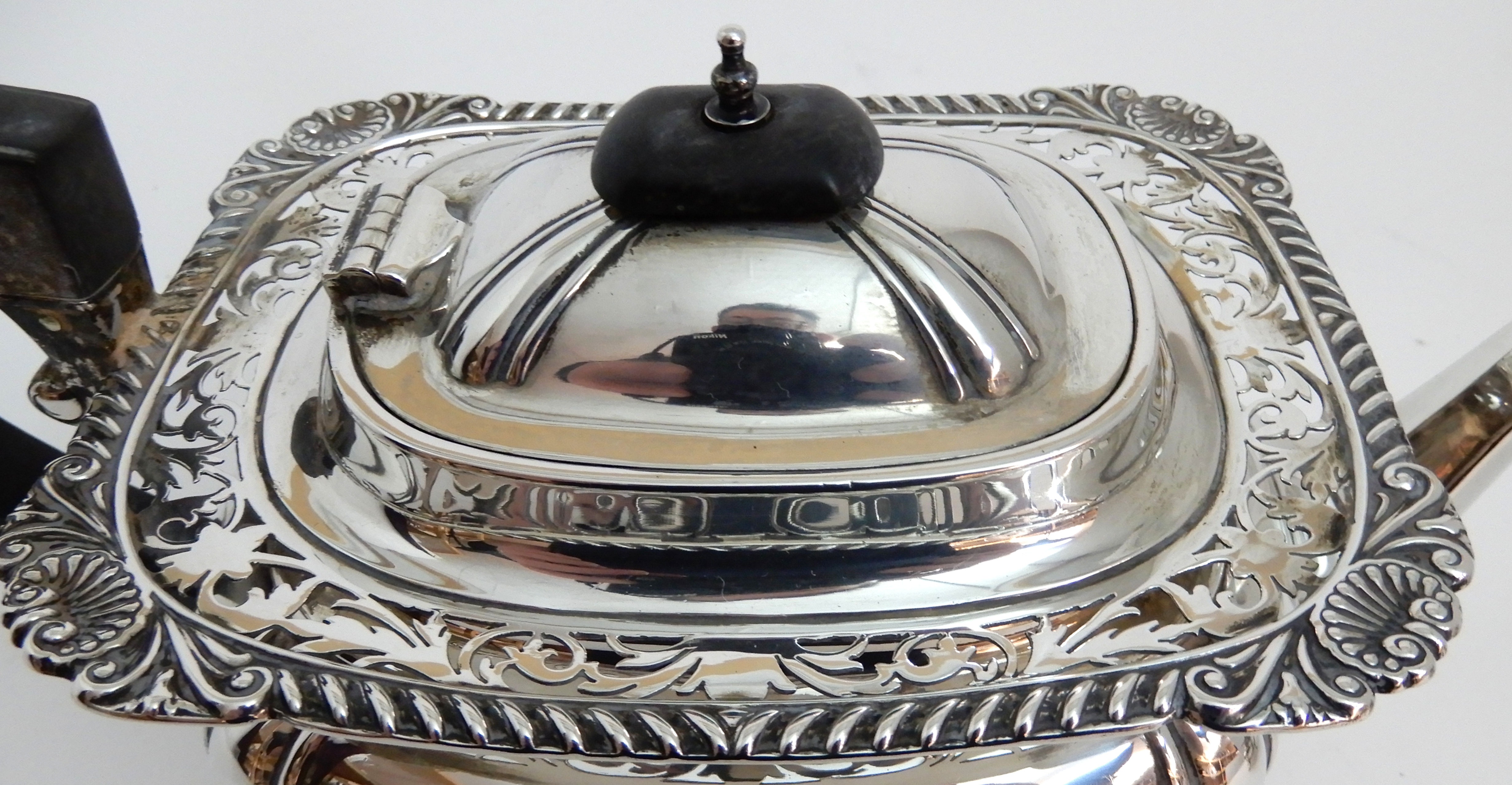 A THREE PIECE SILVER TEA SERVICE by James Deakin & Son, Sheffield 1919, of rounded rectangular - Image 3 of 10