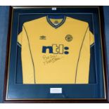 A YELLOW CELTIC SHORT-SLEEVED SHIRT autographed by Martin O'Neill, with caption stating Signed by
