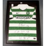A GREEN AND WHITE CELTIC SHORT-SLEEVED SHIRT the front bearing numerous player autographs from the