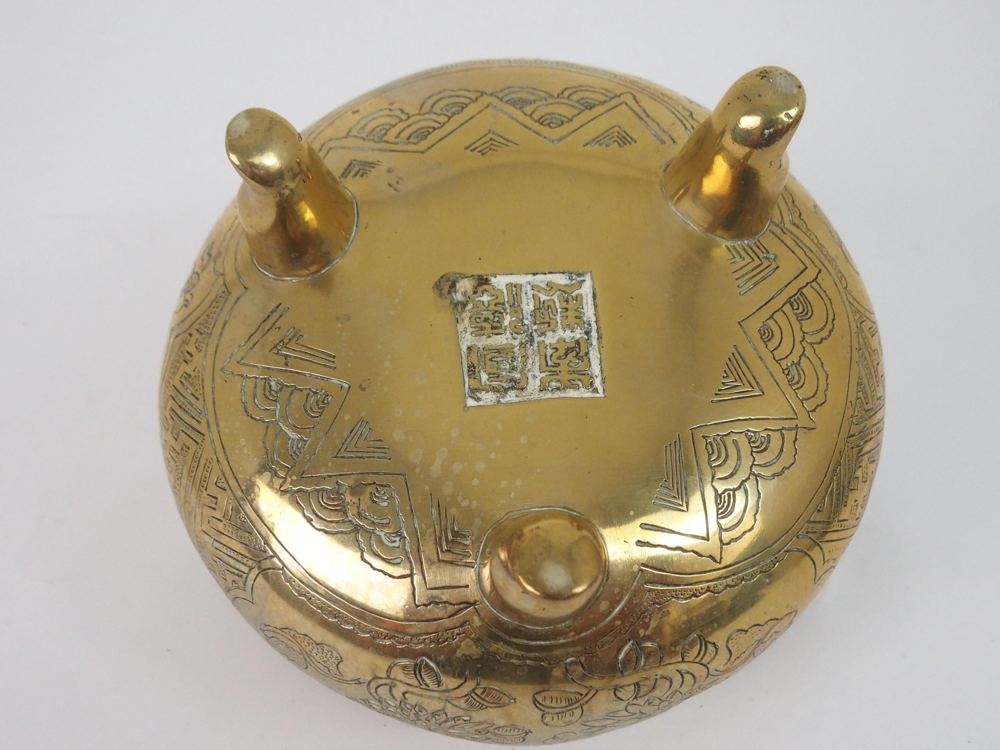 A CHINESE BRASS INCENSE BURNER with lug handles above a key pattern band and decorated with precious - Image 5 of 6