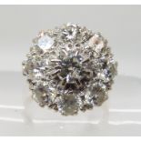 AN 18CT GOLD DIAMOND CLUSTER RING set with estimated 3cts of brilliant cut diamonds in total, in