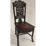 A CHINESE HARDWOOD FAUX BAMBOO CHAIR the back rest pierced and carved with birds, bats and squirrels