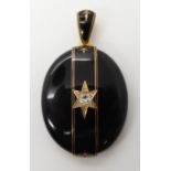 A DIAMOND SET MOURNING PENDANT LOCKET in bright yellow metal with black enamel, the body in black