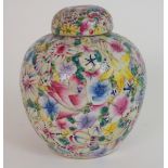 A CHINESE MILLEFIORI JAR AND COVER painted all over with brightly coloured flowers, red six