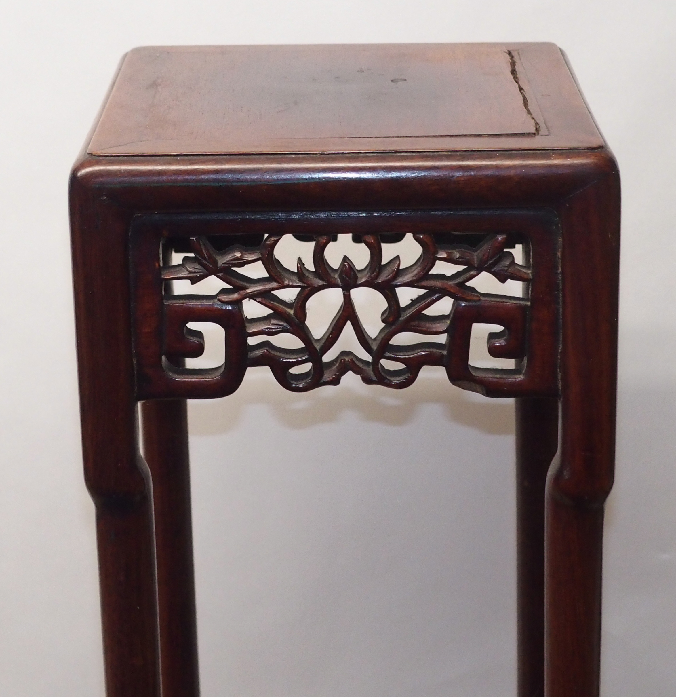 A CHINESE HARDWOOD VASE STAND the square top above foliate and key pattern frieze and on slender - Image 6 of 7