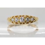 AN 18CT GOLD FIVE STONE DIAMOND RING set with estimate approx 0.22cts of old cut diamonds in a
