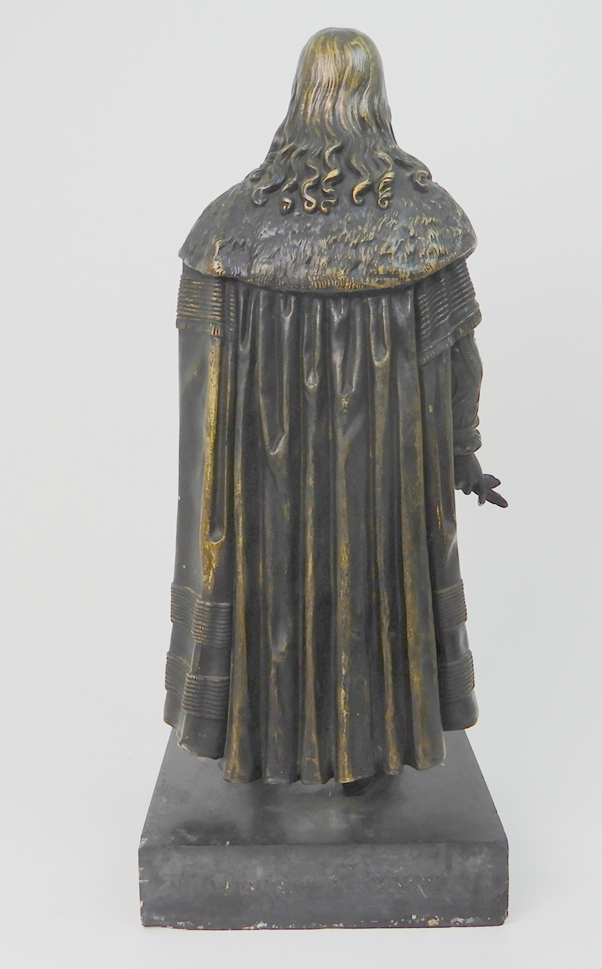 A BRONZED MODEL OF A MAN wearing fur trimmed robes, upon slate base, 46cm high Condition Report: - Image 5 of 7