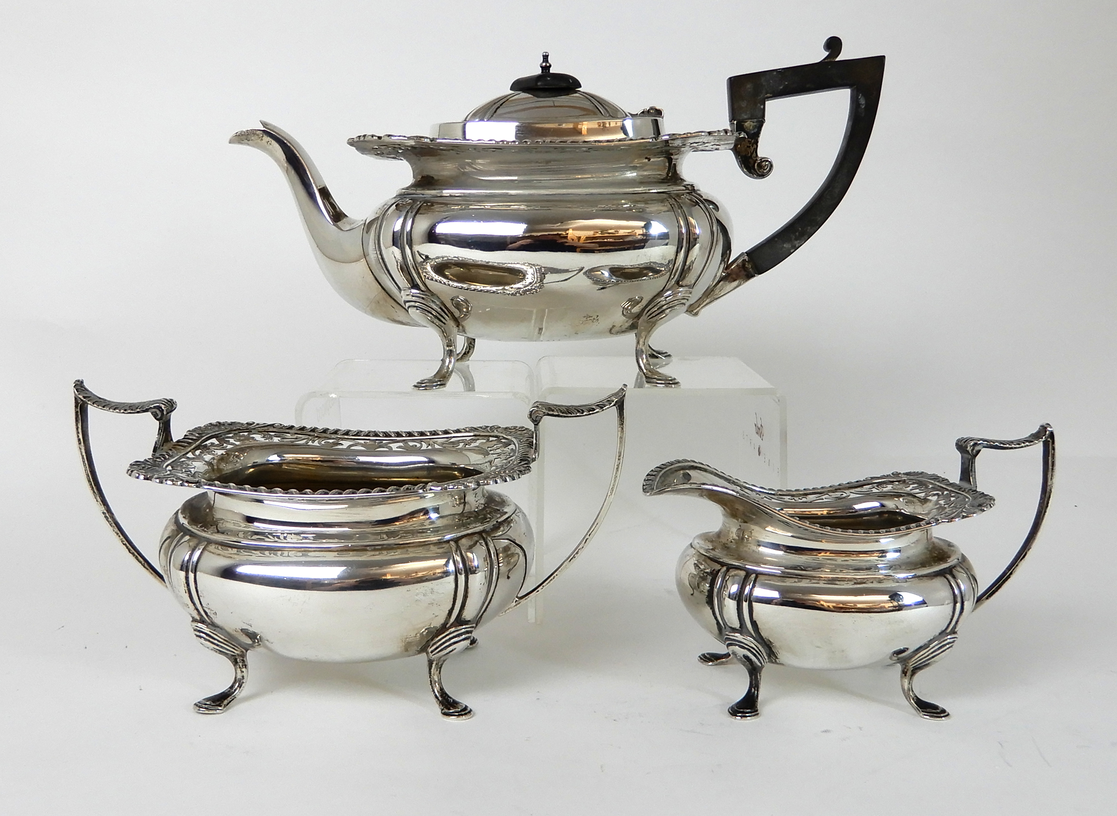 A THREE PIECE SILVER TEA SERVICE by James Deakin & Son, Sheffield 1919, of rounded rectangular - Image 2 of 10