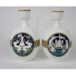 A PAIR OF COX & SONS, LONDON WINE EWERS possibly decorated by Moyr Smith, one decorated with three