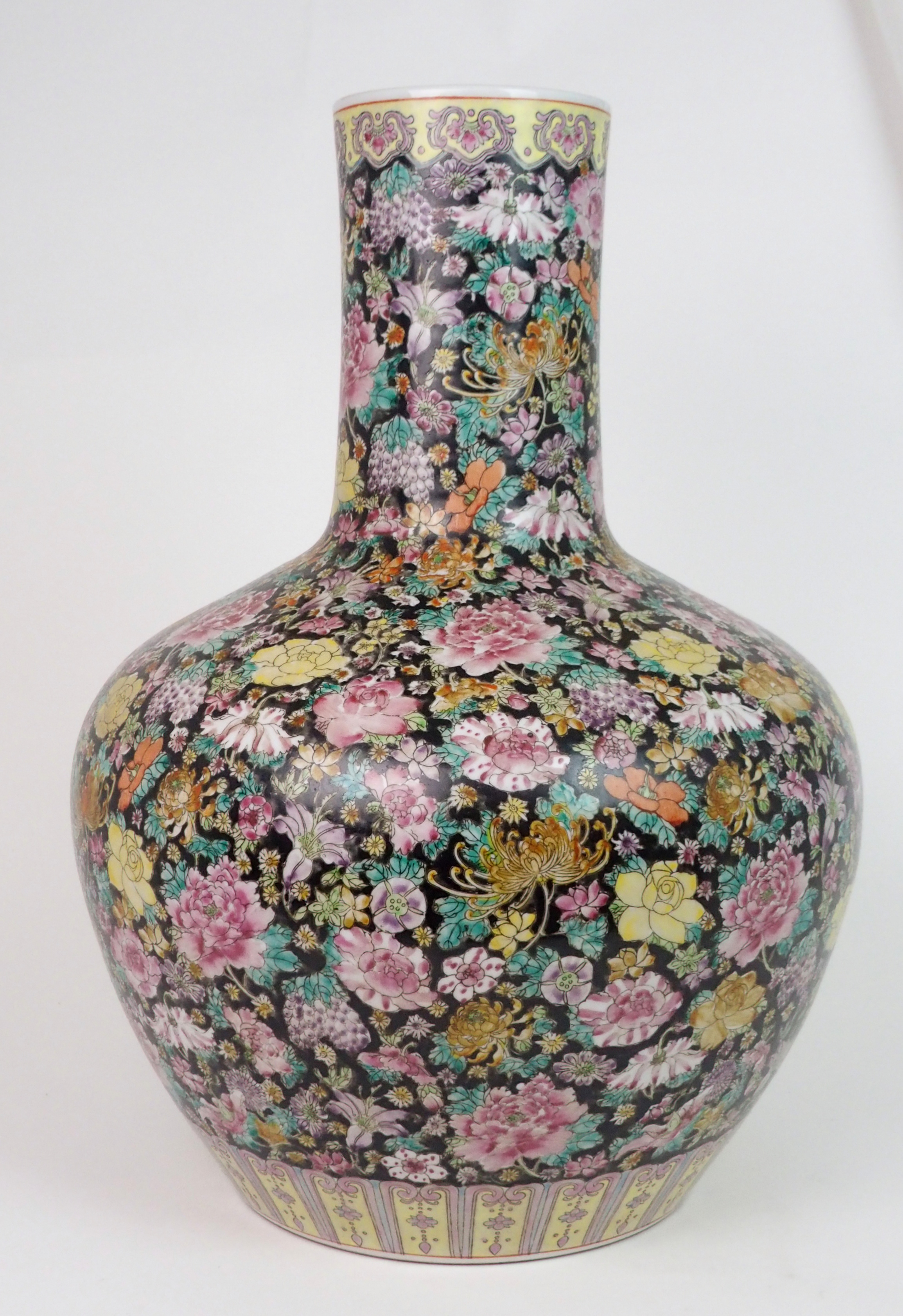 A LARGE CANTON MILLIEFIORI PATTERN BALUSTER VASE painted with allover floral design, within yellow