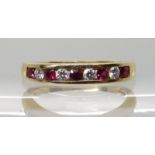 AN 18CT RUBY AND DIAMOND HALF ETERNITY RING set with estimated approx 0.20cts of brilliant cut