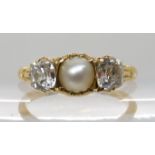 AN 18CT GOLD DIAMOND AND PEARL RING set with two old cut diamonds of estimated approx 0.80ct
