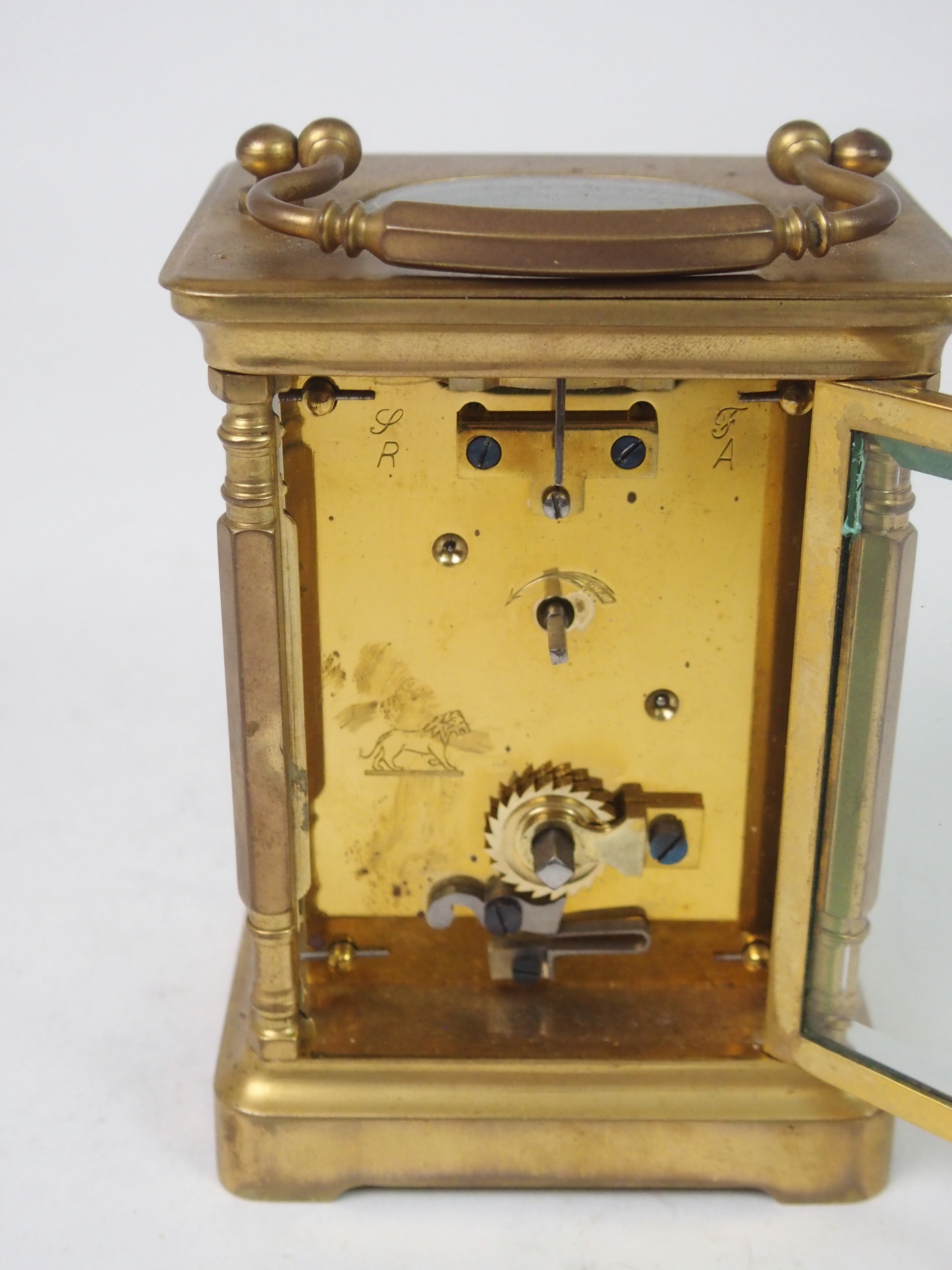 A FRENCH BRASS AND GLASS CARRIAGE CLOCK the white enamel dial with Roman Numerals, retailed by W. - Image 6 of 8