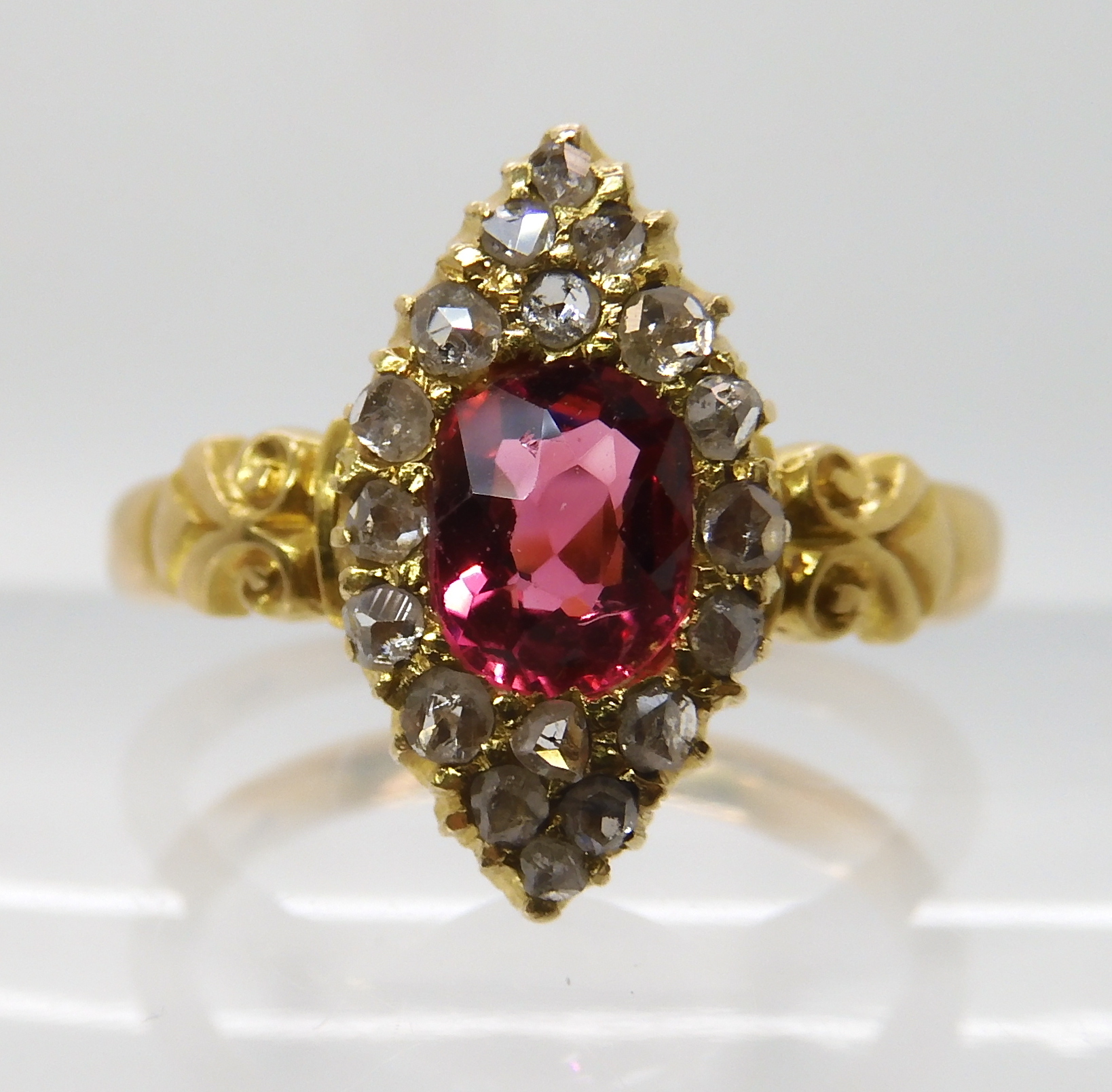 A YELLOW METAL ROSE CUT DIAMOND AND PINK GEM SET RING stamped 18 to the scroll shouldered - Image 2 of 5
